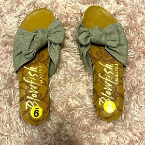 Sandals/slides. Never worn, soft fabric material.